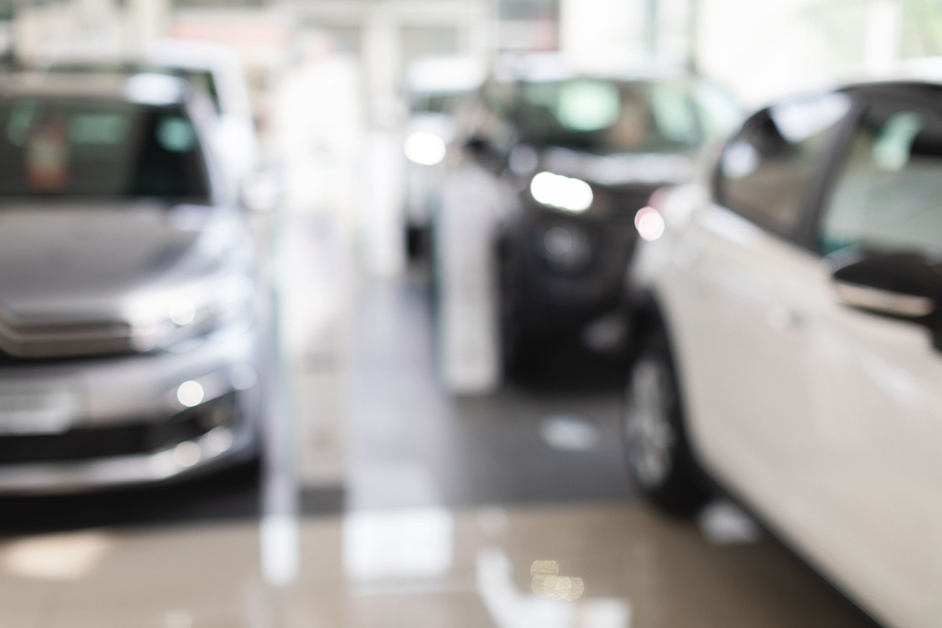 Luxury automobiles in vip showroom, blurred background